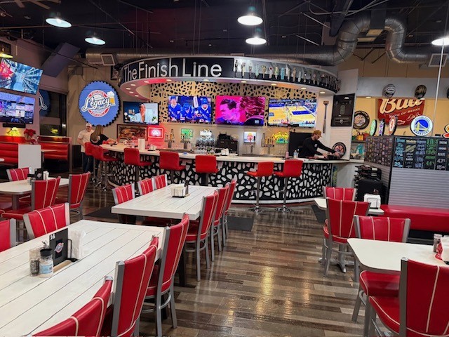 Interior seating and TV screens at Legacy Sports Bar and Grill in Lincoln, California